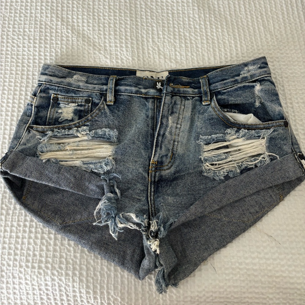 One denim, size 26, medium wash ripped shorts